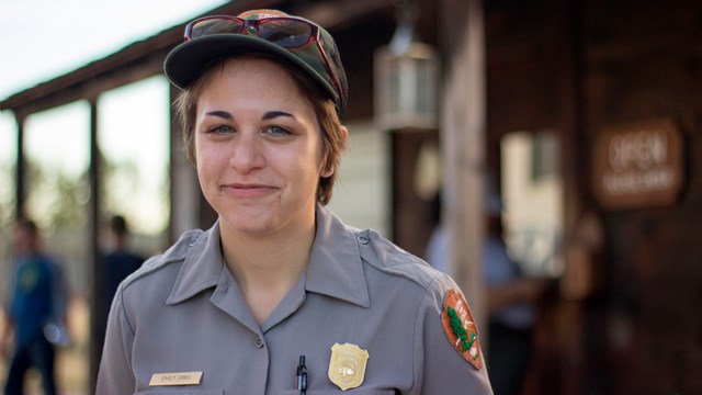 A woman in a national park ranger uniform inside Fort Vancouver.