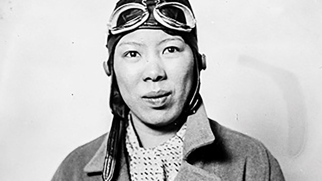 A Chinese American woman dressed as a pilot.