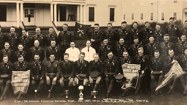 Black and white photo of soldiers on the Vancouver Barracks Parade Ground.