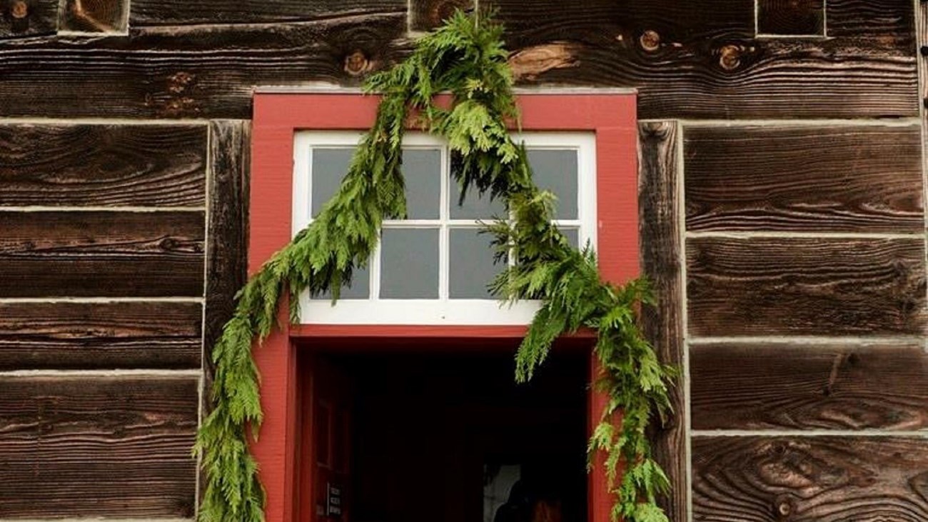 A garland hanging over a doorway at Fort Vancouver.