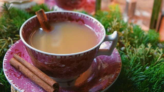 A teacup filled with hot buttered rum.