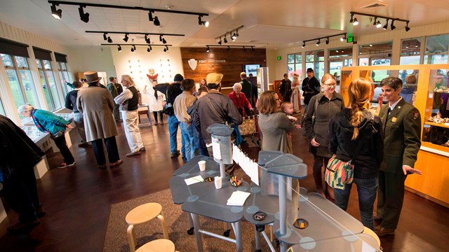 People peruse exhibits inside the Fort Vancouver Visitor Center
