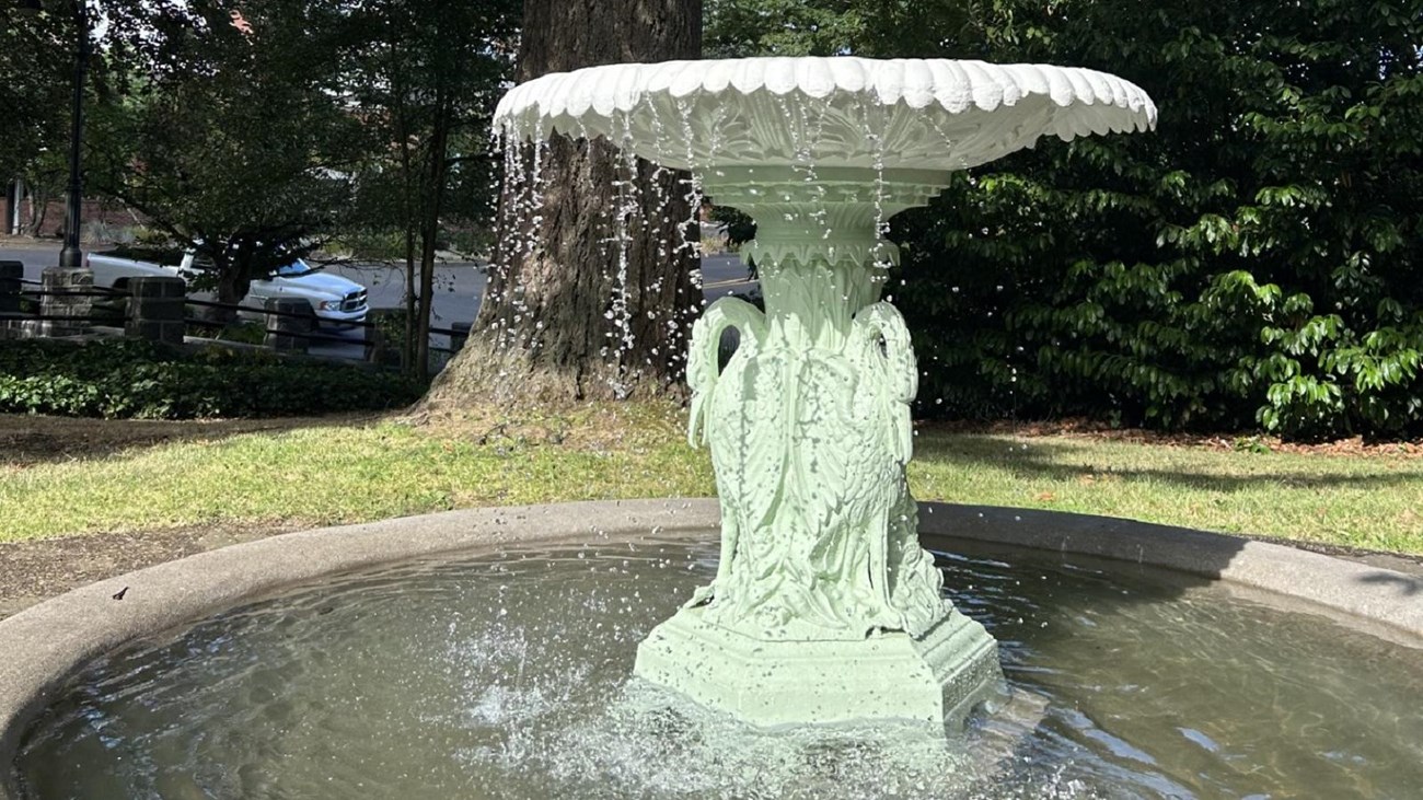A light green and white fountain.