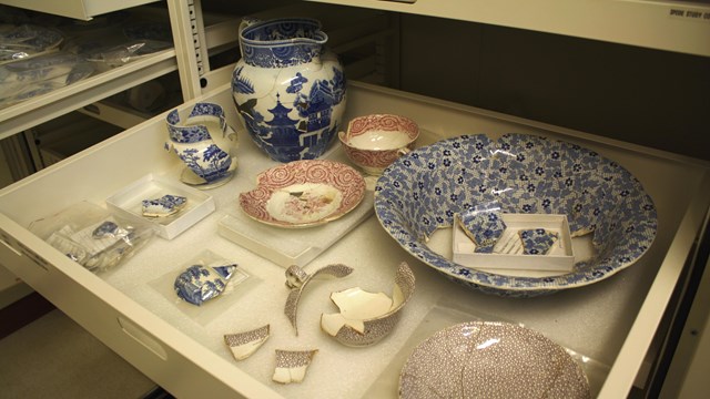 An open drawer of Spode ceramics.