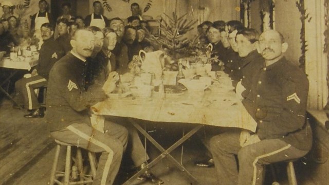Black and white photo of enlisted men celebrating Christmas in the 1880s.