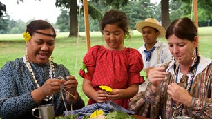 Costumed volunteers re-enact Hawaiian crafts at Fort Vancouver National Historic Site