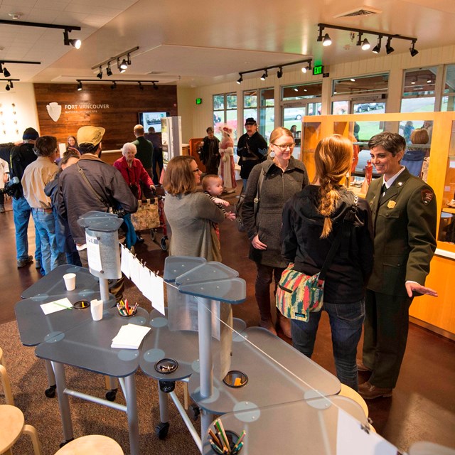 People peruse exhibits inside the Fort Vancouver Visitor Center