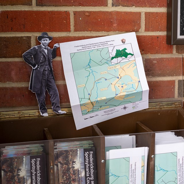 Ulysses Grant cut out holding a trail map