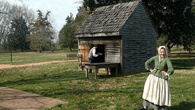 A historical interpreter posses for a picture on the Jon Dickinson Plantation. 