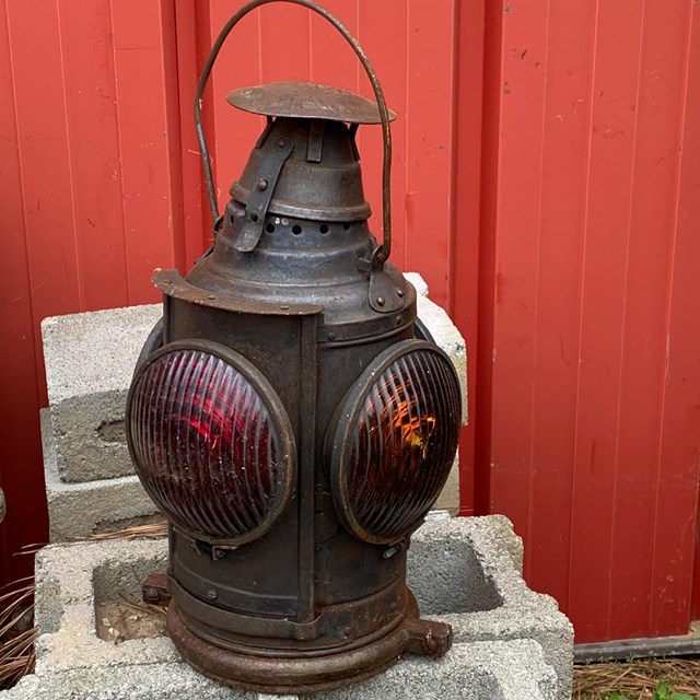 An old metal railroad lamp. 
