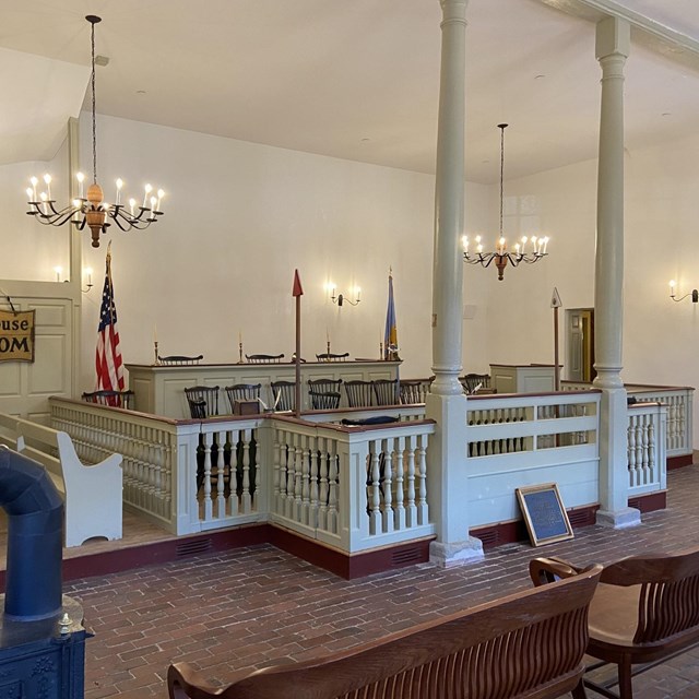 A photograph of the courtroom inside the New Castle Court House