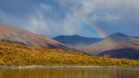 A rainbow over the Noatak River and mountains