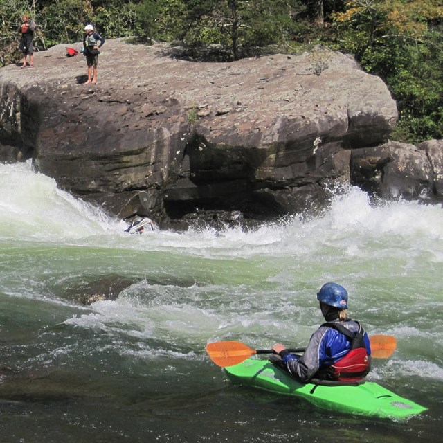 Kayers and rafters on going through the rapids on the Gauley River National Recreation Area