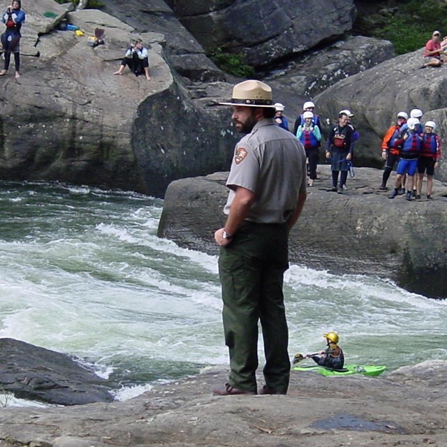 Ranger standing on rock at Gauley River