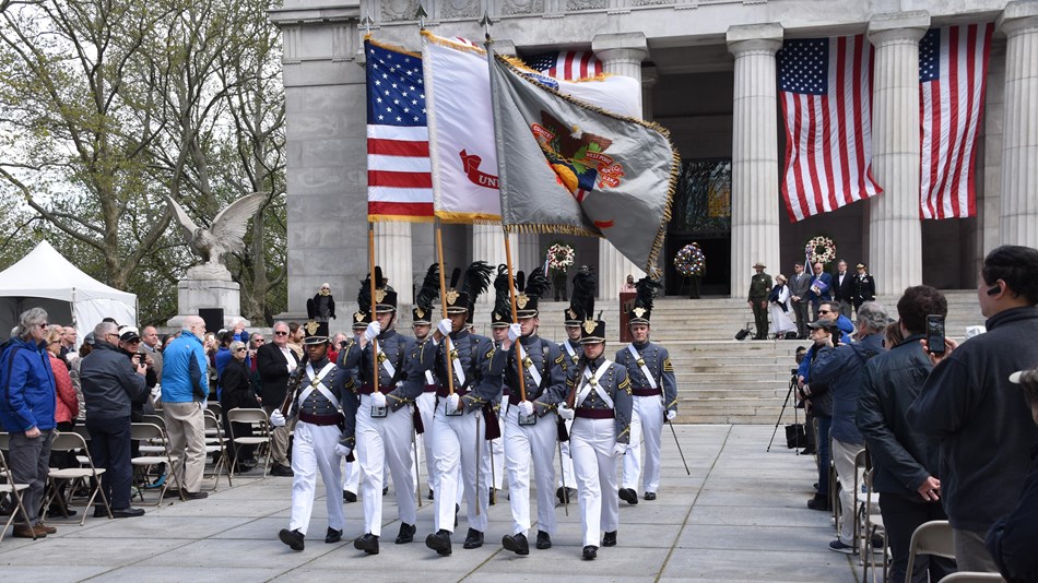 USMA West Point Cadets in full formal military uniforms carrying the colors (flags)