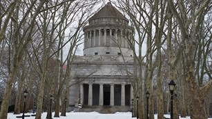 The memorial and foregrounds are covered in snow.