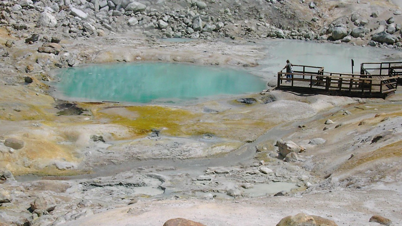 An aqua colored pool in the Bumpass Hell hydrothermal area