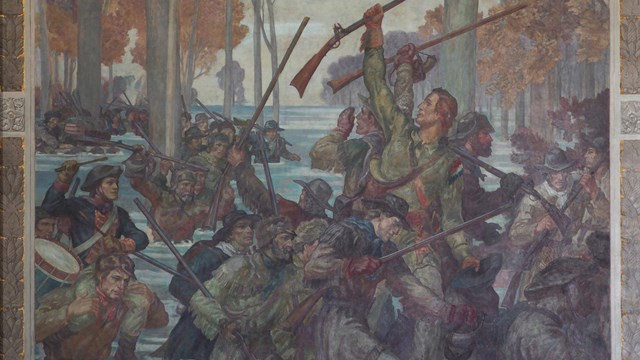Clark and his soldiers walk through the flooded wilderness.