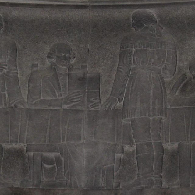Stone carving depicting Clark receiving orders to attack the British western frontier outposts