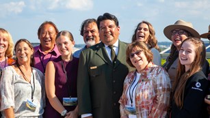 Group of volunteers standing with the National Park Service Director