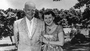 The Eisenhowers stand arm in arm on the rear patio of their Gettysburg home.