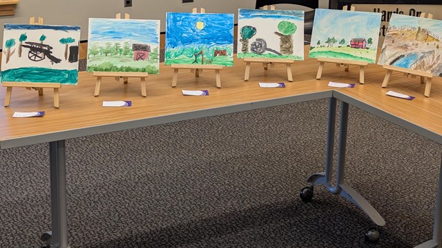 Children's paintings on a table