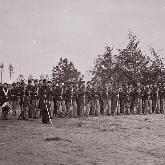 School program about being a civil war soldier. image of united states soldiers in a line.