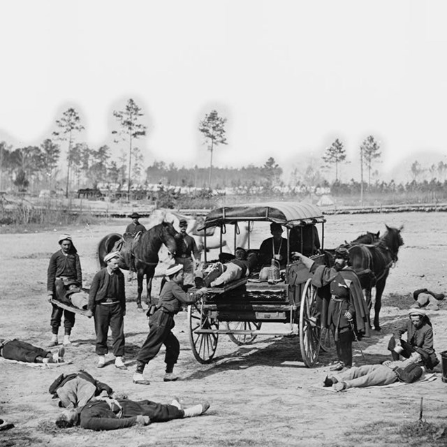 Wounded soldiers are loaded into an ambulance during a drill