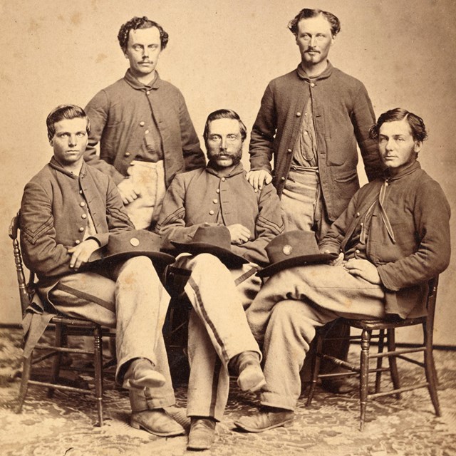 Five Union Civil War soldiers posing for portrait.