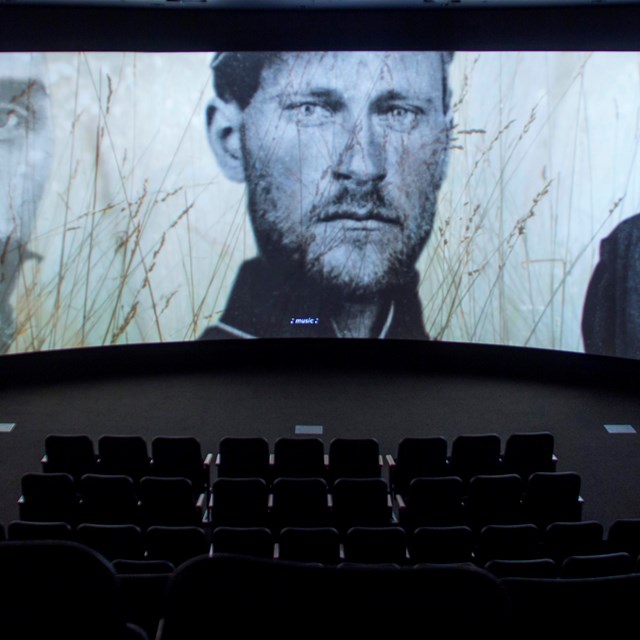 A still of a movie theater playing a Civil War documentary.