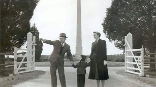 Family standing in front of the Birthplace Monument