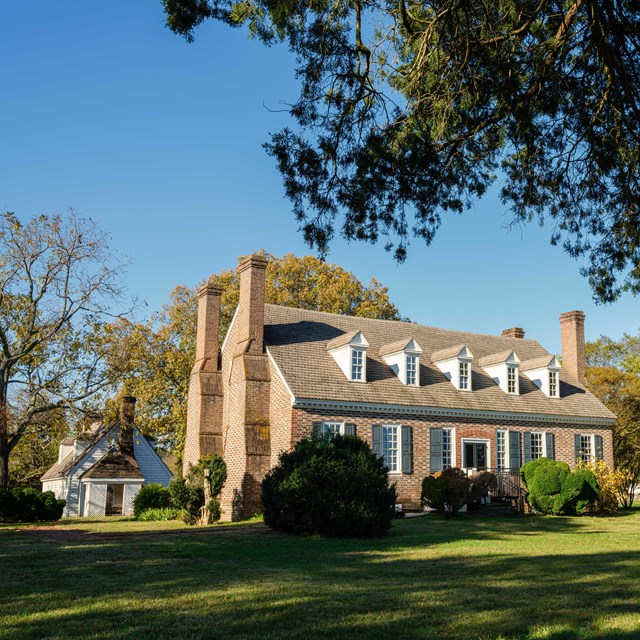 Brick two story with dormers Memorial House Museum