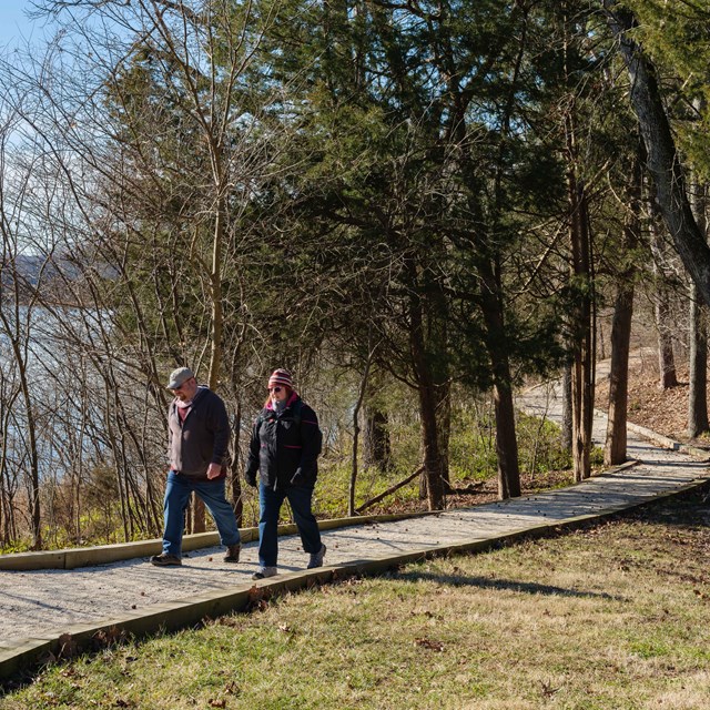 Loose gravel path with two people walking