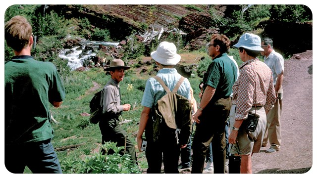 a group of people with a ranger