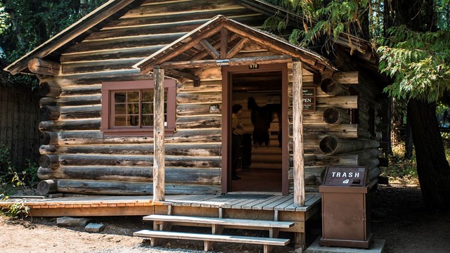 Rustic log cabin with open door