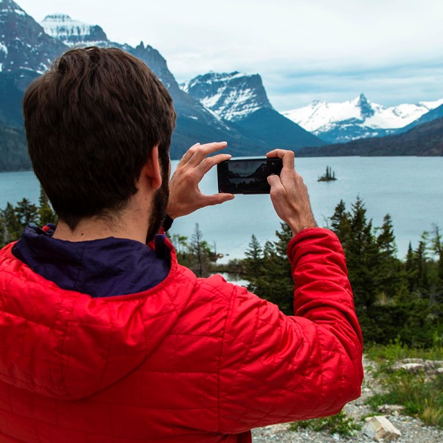 Visitor taking a photo of Wild Goose Island