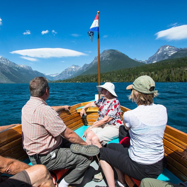 Visitors riding on the bow of the historic De Smet