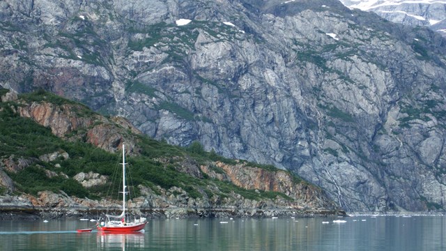 A small sailing ship in a bay