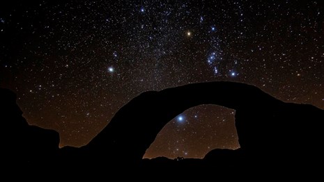 Night view of natural arch with starry sky