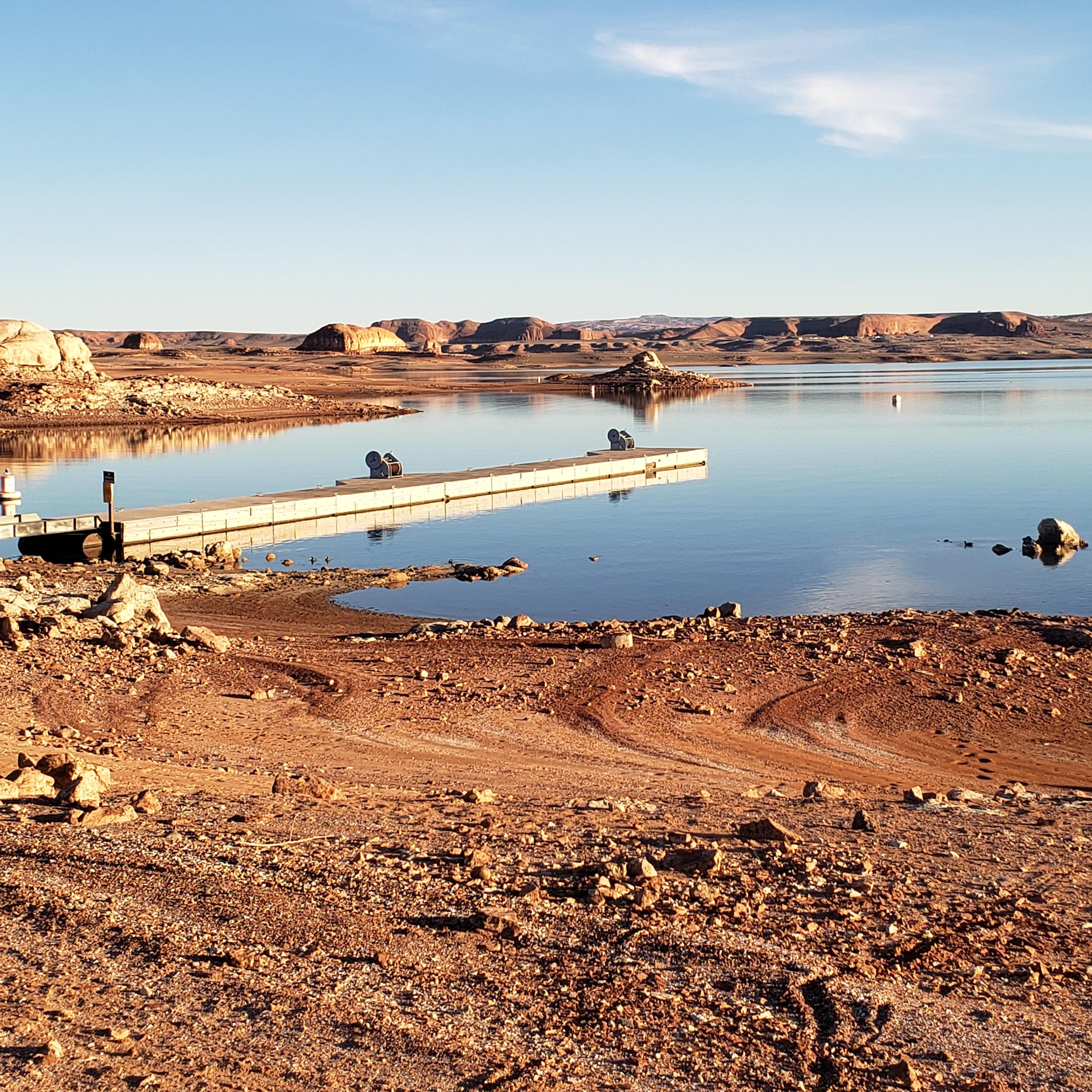Empty dock on a desert lake.