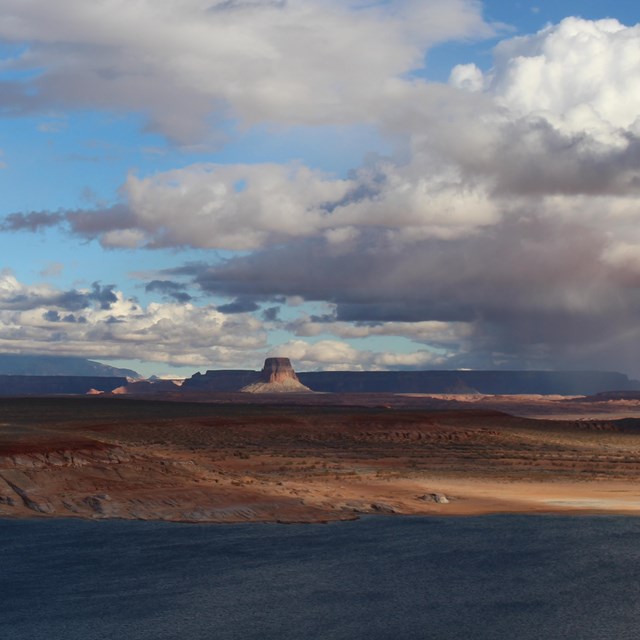 Stormy clouds over a desert lake