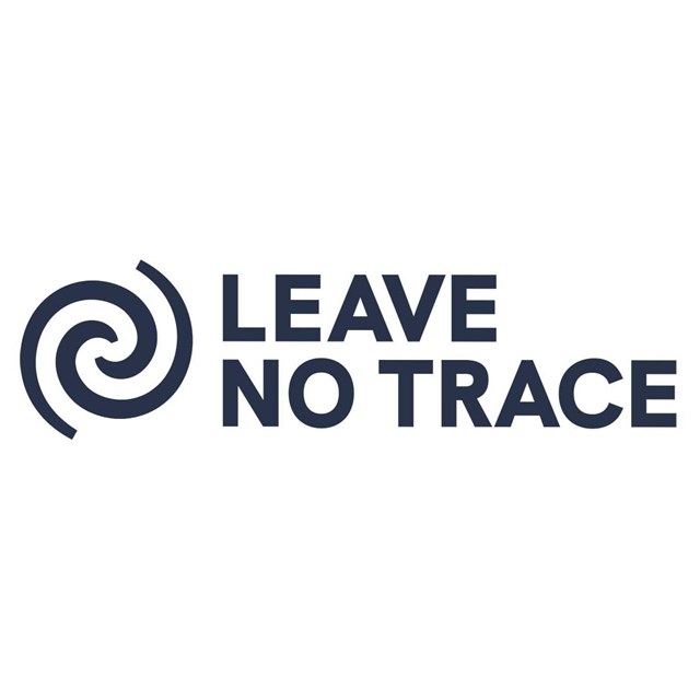 Curved circle logo with gray text Leave No Trace