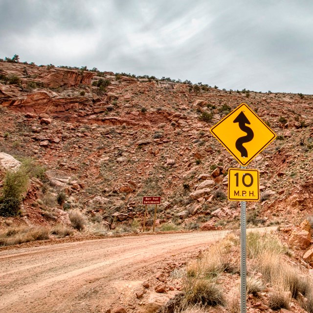 dirt road through rocky hills