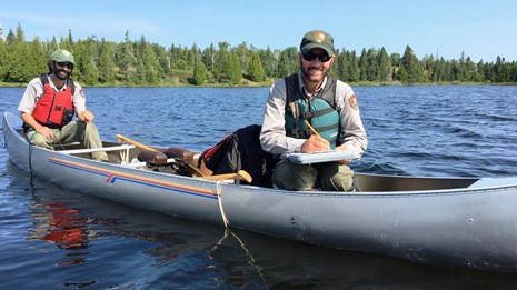 Two biologists in a canoe at Isle Royale National Park