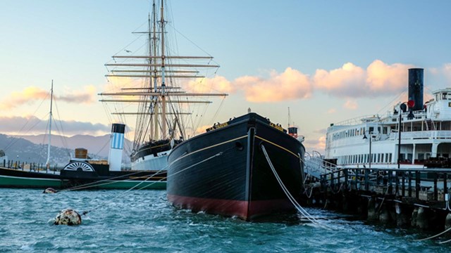 black boat docked on water