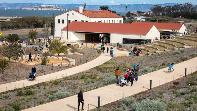 people walk in and around the new crissy field center