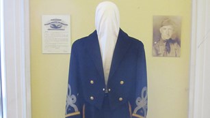 A mannequin dress in an officer's uniform 