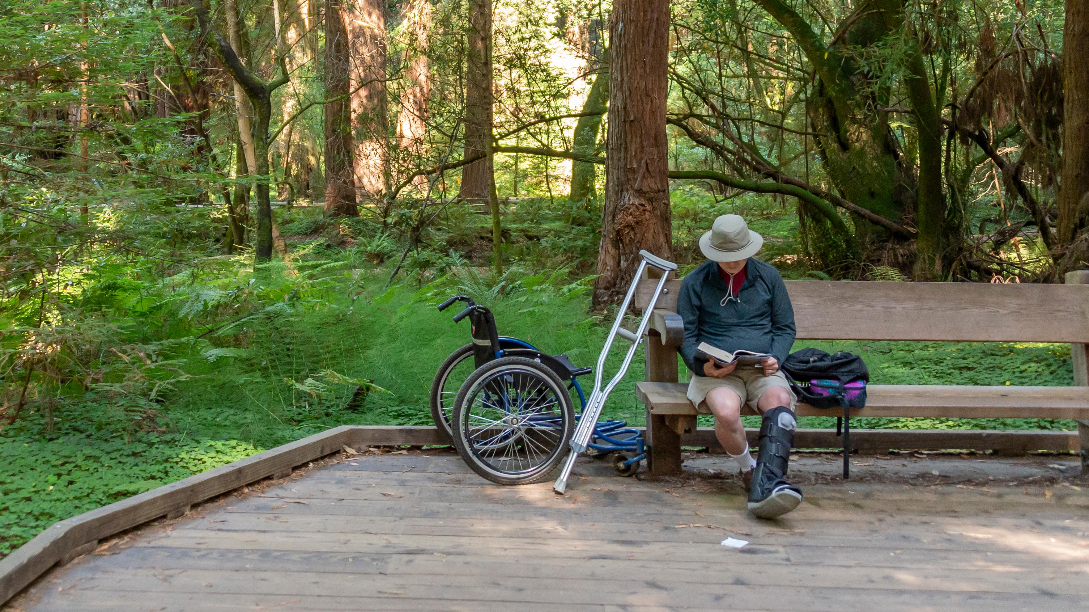 Park visitor using wheelchair accessible trail at Land's End