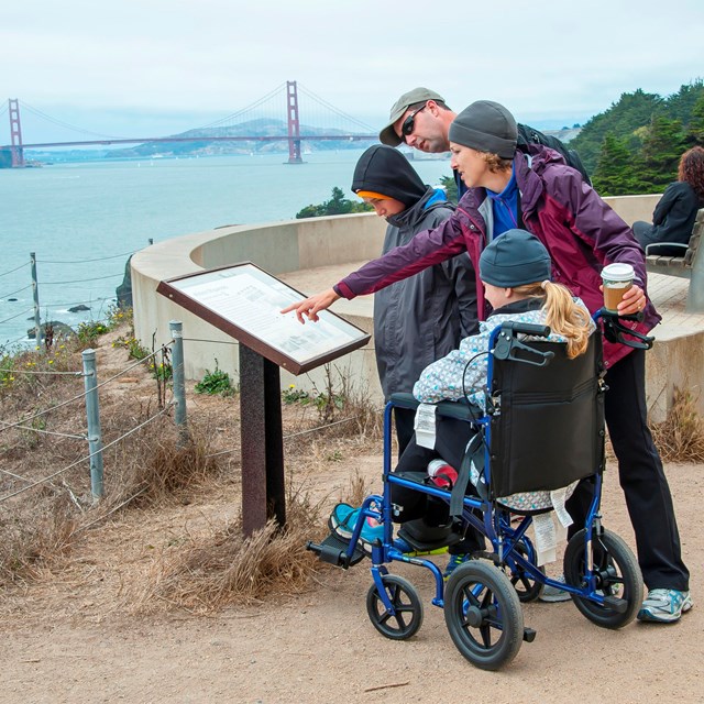 Park visitor using wheelchair accessible trail at Land's End