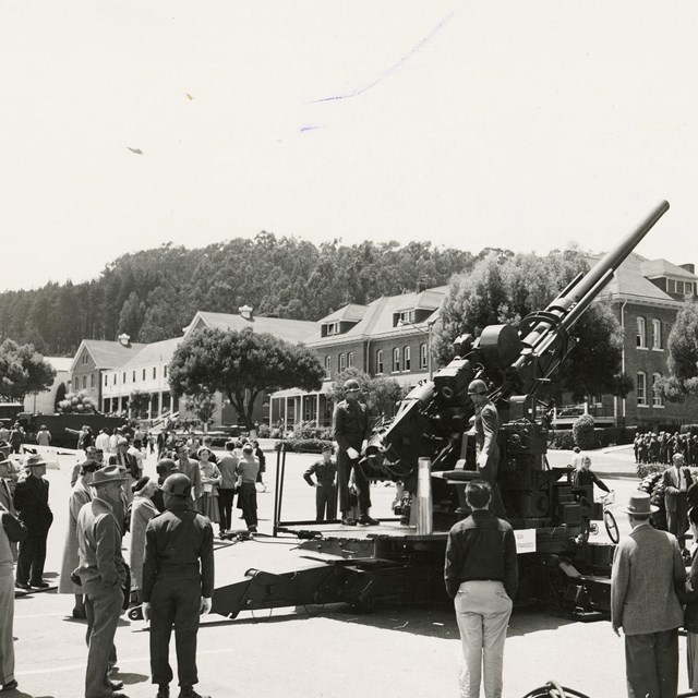 Civilians view an AA gun on the Presidio Parade ground 